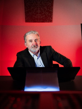 Nigel Latta sitting at a desk